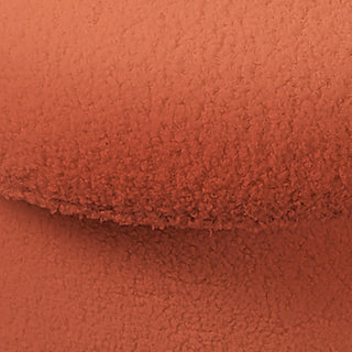Close-up of terracotta boucle fabric texture on Forest Mushroom Ottoman showing looped pattern