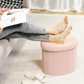 Pink heart-shaped ottoman in bedroom setting next to vanity