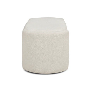 Side view of ivory boucle curved storage ottoman