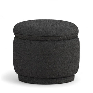 Black round boucle ottoman showing textured fabric and compact storage design