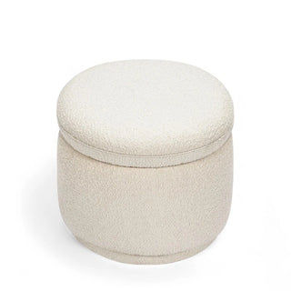 White round boucle ottoman with clean lines and minimalist storage design