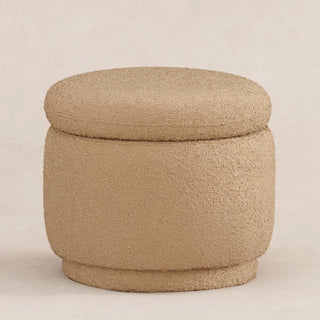 Camel colored round boucle ottoman showing soft texture and proportional design