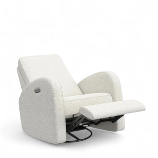 Bottom view of boucle rocking chair showing 360-degree swivel base mechanism