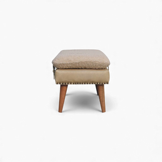Beige ottoman with wooden legs on a white background