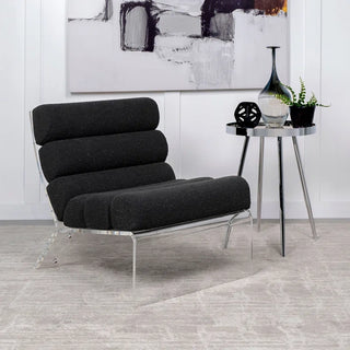 Black boucle accent chair styled in contemporary living space with minimal decor