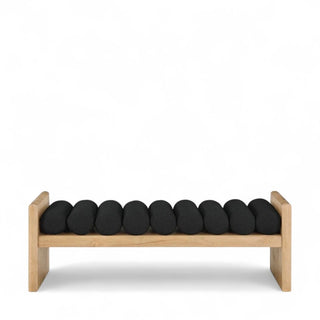 Side profile of black boucle bench showing wooden frame structure