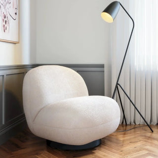 White boucle accent chair in modern living room setting with minimalist decor