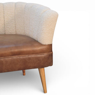 Brown leather chair with a textured beige backrest on a white background