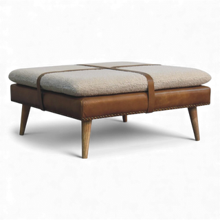 Ottoman with brown leather and beige cushion on a white background