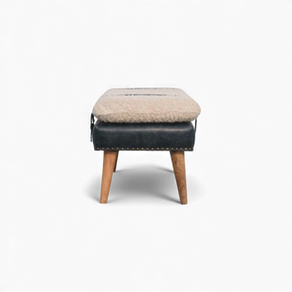 Stool with beige cushioned top and blue upholstered seat on a white background