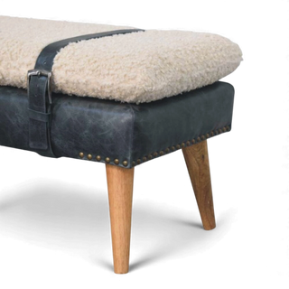Stool with sheepskin seat and leather sides on a white background