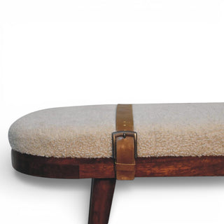 Round ottoman with a wooden base and beige cushion on a white background