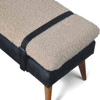 Bench with beige cushion and black strap on a white background