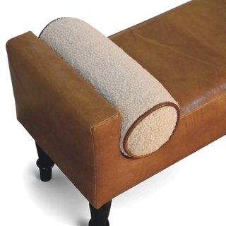 Brown leather bench with a textured beige armrest on a white background