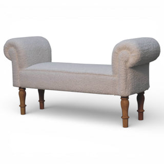 Decorative bench with textured fabric and wooden legs on a white background