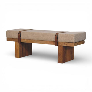 Wooden bench with beige cushion on a white background