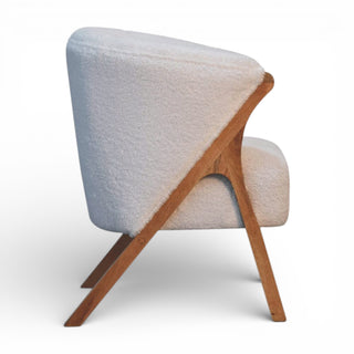 Modern chair with wooden frame and textured fabric on a white background