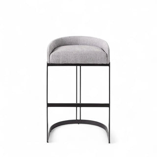 Front view of gray boucle counter stool with curved bucket seat and metal sled base