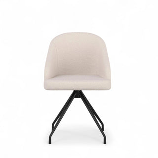 Front view of the boucle desk chair showing its contoured back, soft upholstery, and modern metal legs.