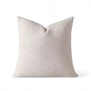 Ivory boucle pillow cover with soft texture and hidden zipper, displayed on white background.