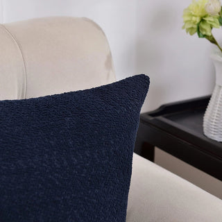 Boucle pillow covers styled on bed with complementary neutral decor