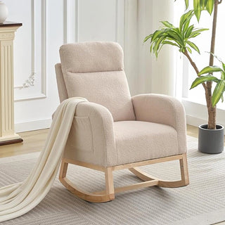Boucle rocking chair in living room setting next to indoor plant for scale