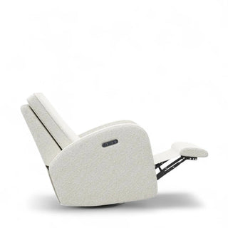 White boucle rocking chair in reclined position showing full extension capability