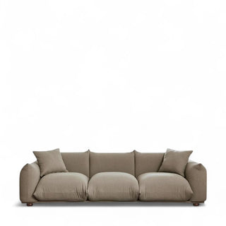 Mid-century modern boucle sofa in mocha color with three plush cushioned seats