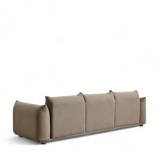 Rear view of Ashcroft mid-century modern boucle sofa in mocha showing clean lines, three-cushion back design, and rounded arms with wooden feet visible beneath the textured upholstery