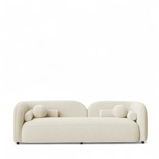 Ivory boucle sofa with round arms and clean lines shown in minimal setting
