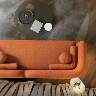 Orange boucle sofa in contemporary living room with decorative accessories