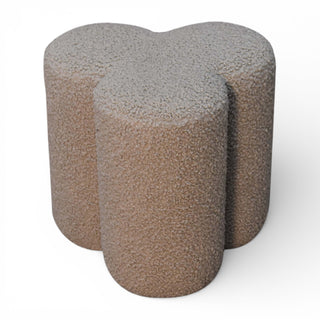Three textured cylindrical stones on a white background