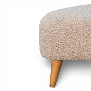 Beige textured ottoman with wooden legs on a white background