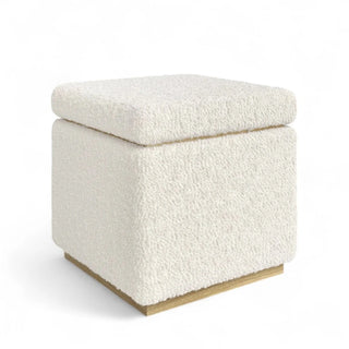 Side view of boucle storage ottoman showing textured fabric detail and block base