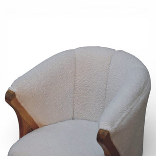 White upholstered chair with wooden armrests on a white background