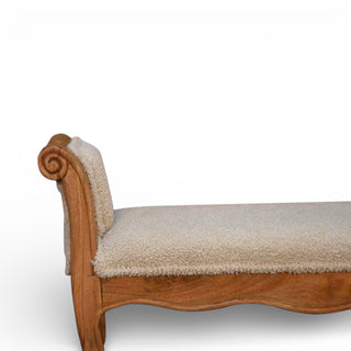 Wooden bench with beige cushion on a white background