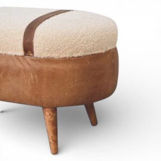 Wooden ottoman with a textured beige cushion on a white background