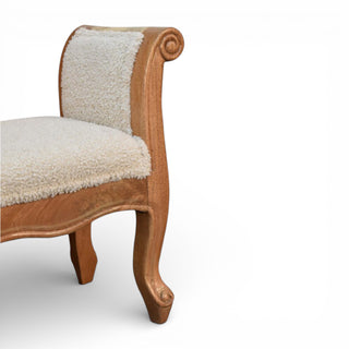 Wooden chair with white upholstered seat and backrest on a white background