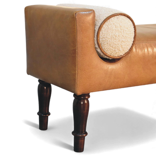 Brown leather armchair with wooden legs on a white background