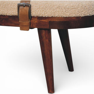 Close-up of a wooden chair with a metal buckle on a white background