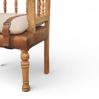 Wooden chair with brown leather seat and white cushion on a white background