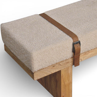 Wooden bench with a cushioned seat and leather strap on a white background