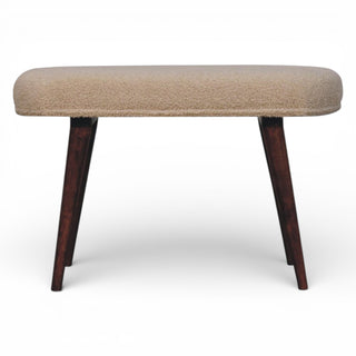 Beige cushioned stool with dark wooden legs on a white background