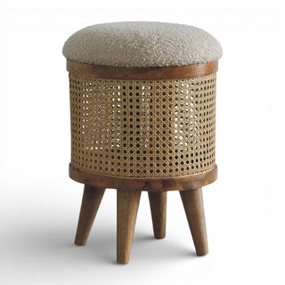Wooden stool with woven design and textured cushion on a white background