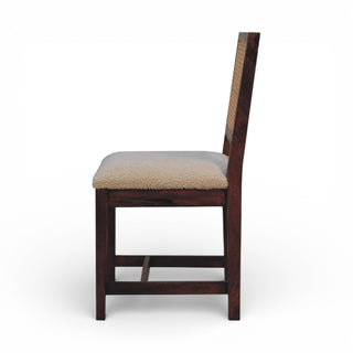 Wooden chair with a cushioned seat on a white background