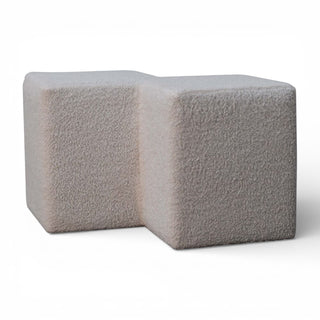 Two gray textured cubes on a white background