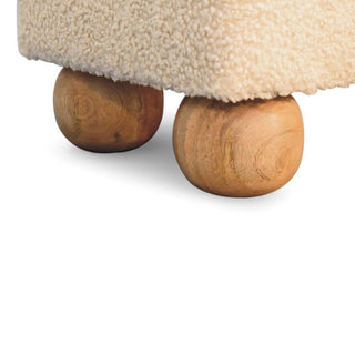 Close-up of a textured surface with wooden wheels on a white background