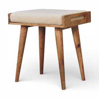 Wooden stool with a cushioned seat on a white background