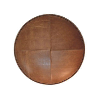 Round brown leather ottoman on a white background
