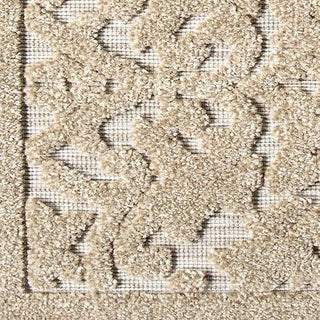 Macro view of boucle rug's floral damask design showing intricate pattern details